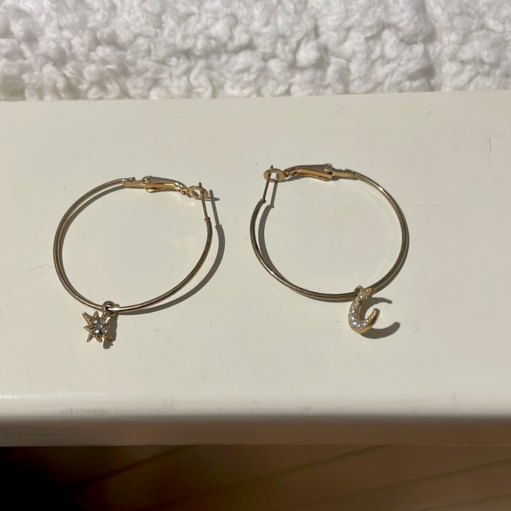 Moon and star thin gold hoops. No backings needed.